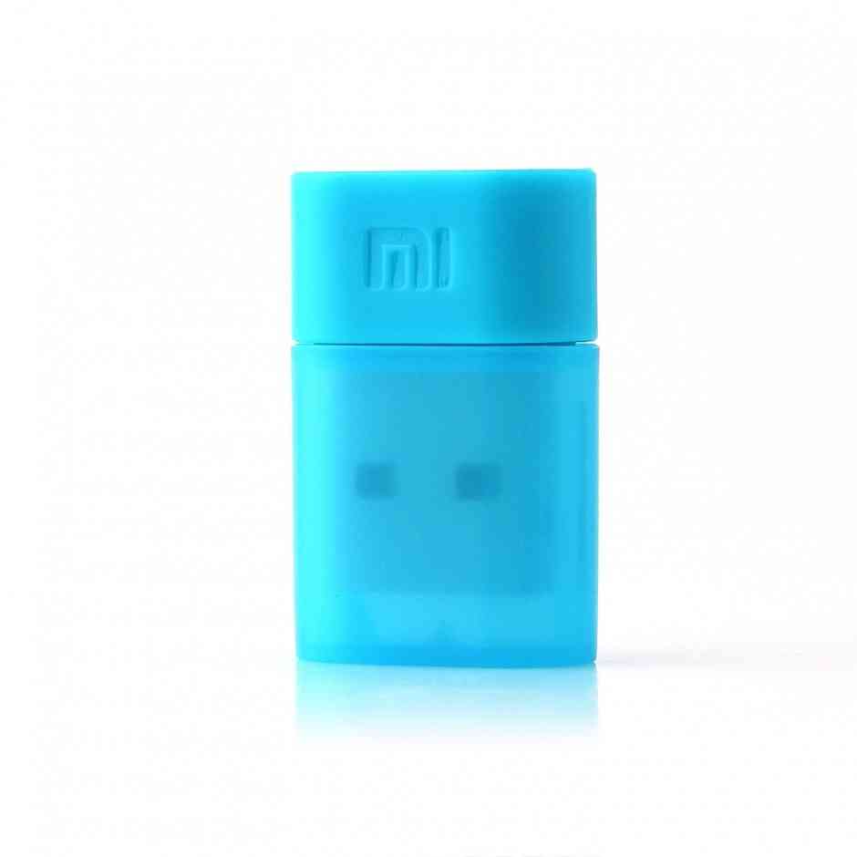 Mi wlan. Xiaomi mi Portable WIFI. Ксиоми флешка голубая. Адаптеры Wi-Fi ми. Bluetooth адаптер синий.